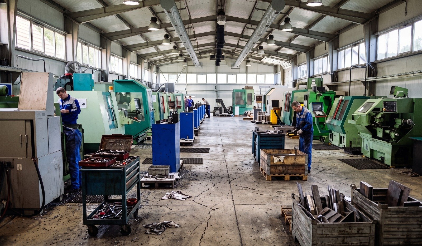 CNC machining workshop with production machines and operators